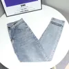 Designer jeans high end fjädern nytt nätverk rött broderi bokstav samma mångsidiga student smala passform raka ben jeans byxor för män