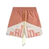 Shorts pour hommes Rhude Patchwork Couleur Contraste Lettre Imprimé Capris Corde Droite High Street Casual Été Lâche Tube Droit Hommes et Femmes Shorts V2vb