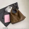 Diseñador de lujo Moda Bolsas de asas Carteras Versión coreana Casual Soft PU Axila Bolsa para mujer 2023 Nuevo estilo perezoso Gran capacidad Simple Solo hombro Tote Bolso para mujer