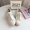 Zapatos casuales 2024 lona de medio arrastre femenino primavera y verano transpirable paso estudiante estilo coreano de moda único