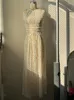 Arbetsklänningar Elegant grimma veckad kostym Kvinnor Lace Up Backless Short Solid Fold Top Set 2024 Fashion Female Loose Long Kirts 2 Piece Set