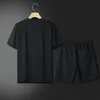 Mode d'été hommes et femmes Shorts ensembles de survêtement à manches courtes 100% coton noir t-shirt Shorts imprimés ensemble masculin vêtements de marque pour hommes
