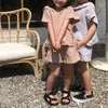 Conjuntos de roupas crianças conjunto moda primavera verão terno solto cor sólida com capuz meninos e meninas shorts de manga curta