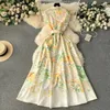 Grundläggande casual klänningar sommar Nytt mode 2024 Summer Holiday Long Dress Kvinnors underbara ärmlös Slå ner Neck Floral Print Belt Robe Beach Vestidos