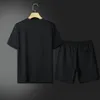 Menina de tracksuits de verão Moda de verão e shorts femininos conjuntos de traacos curtos de manga curta 100% algodão preto shorts imprimem macho conjunto masculino roupas de marca#l-v1z6m8