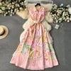 Grundläggande casual klänningar sommar Nytt mode 2024 Summer Holiday Long Dress Kvinnors underbara ärmlös Slå ner Neck Floral Print Belt Robe Beach Vestidos