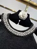 2024 Spring White/Black Women's Dwupoziomowe sukienka Designerka Peading Peating Pearls Szyjka Bez rękawów