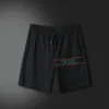 Mode d'été hommes et femmes Shorts ensembles de survêtement à manches courtes 100% coton noir t-shirt Shorts imprimés ensemble masculin vêtements de marque pour hommes