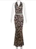 ワークドレスファッションヒョウ柄のプリントスカート2ピースセット女性エレガントなストラップウッドウッドウッドエッジバックレスタンクトップセクシーなヒップパッケージスカート2024
