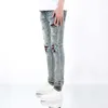 High quality trendy brand spring and summer mens fashionable cat scratch hole slimming jeans Korean elastic small leg pants