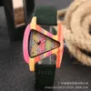 Luxury Mens Watch Femmes Hot Wooden Femme Personality Triangle créatif Small Flying Fish Color Womens montre
