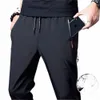 Calças casuais masculinas LG Plus Size Sweatpants Summer Cool Stretch Pants Masculino Preto Cinza Fino Solto Quick-Seco Lg Sport Corredores v8tj #