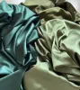 Tissu 150 couleurs en stock doublure en satin tissu doux de mariage de mariage décoration en tissu matériau matériau de fond 1 mètre Prix 150 cm de large