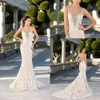 Abiti da sposa Sirena Applicazioni in pizzo vintage Abiti da sposa con scollo a cuore Abito a tromba gotico con perline sexy senza schienale per le spose