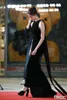 Sexy Long Black Jewel Neck Velvet Celebrity -jurken met boog zeemeermin mouwloze sweep trein ritssluiting terug prom jurken voor vrouwen