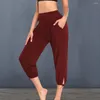 Pantaloni da donna Yoga ritagliati alla moda a vita alta con tasche tinta unita Sport per allenamento casual