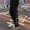 Pantalon de sports de patch bandana hip hop pour hommes avec bouton latéral de sports de sport pantalon hip-hop décontracté coréen pour garçons harajuku 240325
