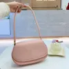 Nouveau sac de créateur Sacs de maquillage Mini Salle d'épaule à demi-lune Sac à dos Front Clour-Courceau petit Sac ovale préféré minimaliste léger