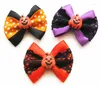 Appareils pour chiens 100pc / lot Halloween Bows Pumpkin en dentelle de toiletage Bands élastiques accessoires pour animaux de compagnie