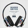 Écouteurs écouteurs HEADWORN Bluetooth Headset Wireless Wireless China-Chic Graffiti Nouvelle campagne de musique stéréo lumineuse H240326