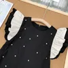 Robes de fille 2024 Arrivée d'été Filles Sans manches O Cou Volants Dot Noir Roupa Infantil Menina Mignon Robe De Soirée Custume 18M-7T