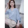 Blousses pour femmes chemises mode V-collier bouton de couleur solide Couleur de couleur Puff Skeve 2024 Printemps Summer Loose Coréen Tops décontracté Drop Livraison OTRAT