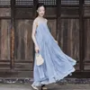 in the Summer of Dark Wind Still Lingers in Silence. Willow Leaf Patchwork with Large Hem As a Base Suspender Skirt Travel Photo Shoot Spray Dye Dress