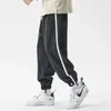 nuova primavera uomo sport a righe pantaloni sportivi coreano fi hip hop harem pantaloni da corsa autunno casual streetwear pantaloni M97P #