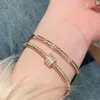 Designer-Schmuck-Armband mit dreiblättrigem Gras, galvanisiertem Zirkon-Titanstahl-Armband, einfach und hochwertig, elegantes und vielseitiges Kunsthandwerk