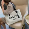 36% di sconto sulla borsa di design 2024 borse in tela grande capacità per la spalla versatile occidentale di donna alla moda e semplice palmare