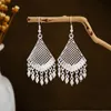 Imitation silver Miao earrings, ethnic minority tourist attraction earrings, Bohemian long leaf tassel earrings for gift collection