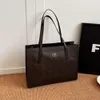 Almacena de bolsos de diseñador al por mayor Bolso de hombro Moda coreana Bolsa de gran capacidad para mujeres New 2024 Avanzado Textura Shoulde Commuting Tote