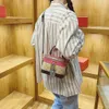 Magasin de gros sacs de créateurs sac à bandoulière à la mode petit rond avec sac à main patchwork de couleur contrastée pour 2024 femmes polyvalentes et élégantes