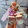 San Li Ou met stromend zand in olie Anime figuur speelgoed Kawaii mode schoen pop sleutelhanger auto tas hanger kinderen geschenken