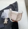 Sac de designer épaule à la mode bandoulière sous les bras Dingdang niche de vente chaude petite multicolore tendance et personnalisée texturée femmes de haute qualité