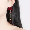 Dangle Chandelier Boucles d'oreilles incrustée de strass Bell avec nœud papillon floqué rouge pour femmes filles automne hiver doux gland en gros Drop D Otpz2