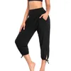 Pantaloni da donna Yoga ritagliati alla moda a vita alta con tasche tinta unita Sport per allenamento casual