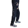 Pantalon de sports de patch bandana hip hop pour hommes avec bouton latéral de sports de sport pantalon hip-hop décontracté coréen pour garçons harajuku 240325