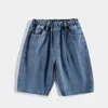 Short masculin Pantalon de jean pour garçons d'été Version coréenne du style occidental des grands enfants en baisse de cinq points mince