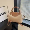 Loja Bolsa Crossbody Barato Exportação High End para Mulheres 2024 Nova Cor Contrastante Bolinho de Mão Simples e Versátil Nicho Moderno Um OmbroDVRP