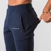 Alphalete style hommes marque Jogger pantalons de survêtement homme gymnases entraînement Fitn Cott pantalon mâle décontracté Fi pantalon de survêtement maigre y7IJ #