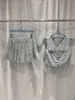 Designer Set av högkvalitativ ärmlös V-Neck Pocket Top veckad kjol för kvinnoklänning