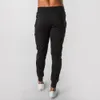 2021 Nouveaux muscles Fitn Entraînement de course Pantalons de sport Pantalons de coton respirants pour hommes Pantalons de santé décontractés à bouche mince f5gd #