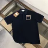 Klassiska poloshirts kvinnor t shirt sommar bokstav ficka kortärmade skjortor män kvinnor casual grafisk tee tre färg