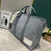 M22537 Week-End Tote Washed Demin fashion mens travel bags womens luxurys designers duffels bag Denim flower briefcase duffel purse with shoulder strap