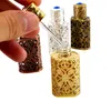 Botellas de almacenamiento 3ML Botella de perfume de Oriente Medio Dispensador de aceite esencial de metal en relieve calado