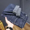 Calças de brim de alto nível homens meados de cintura solta montagem fi calças casuais super macia pele amigável jeans quatro mares 6100 z8MH #