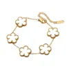 Doppelseitiges Kleeblatt-Armband aus 18-karätigem Gold mit fünfblättriger Blume