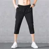 Męskie sprężyste spodenki sportowe szybkie suche szorty treningowe z kieszeniami swobodne sportowe szorty gimnastyczne luźne 3/4 spodnie jogger y8hu#