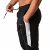 2021 Nouveaux muscles Fitn Entraînement de course Pantalons de sport Pantalons de coton respirants pour hommes Pantalons de santé décontractés à bouche mince f5gd #